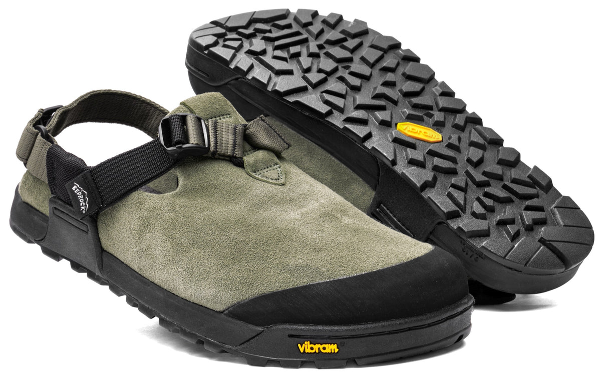 A pair of green leather suede mountain clogs with an adjustable strap and a rugged vibram sole.