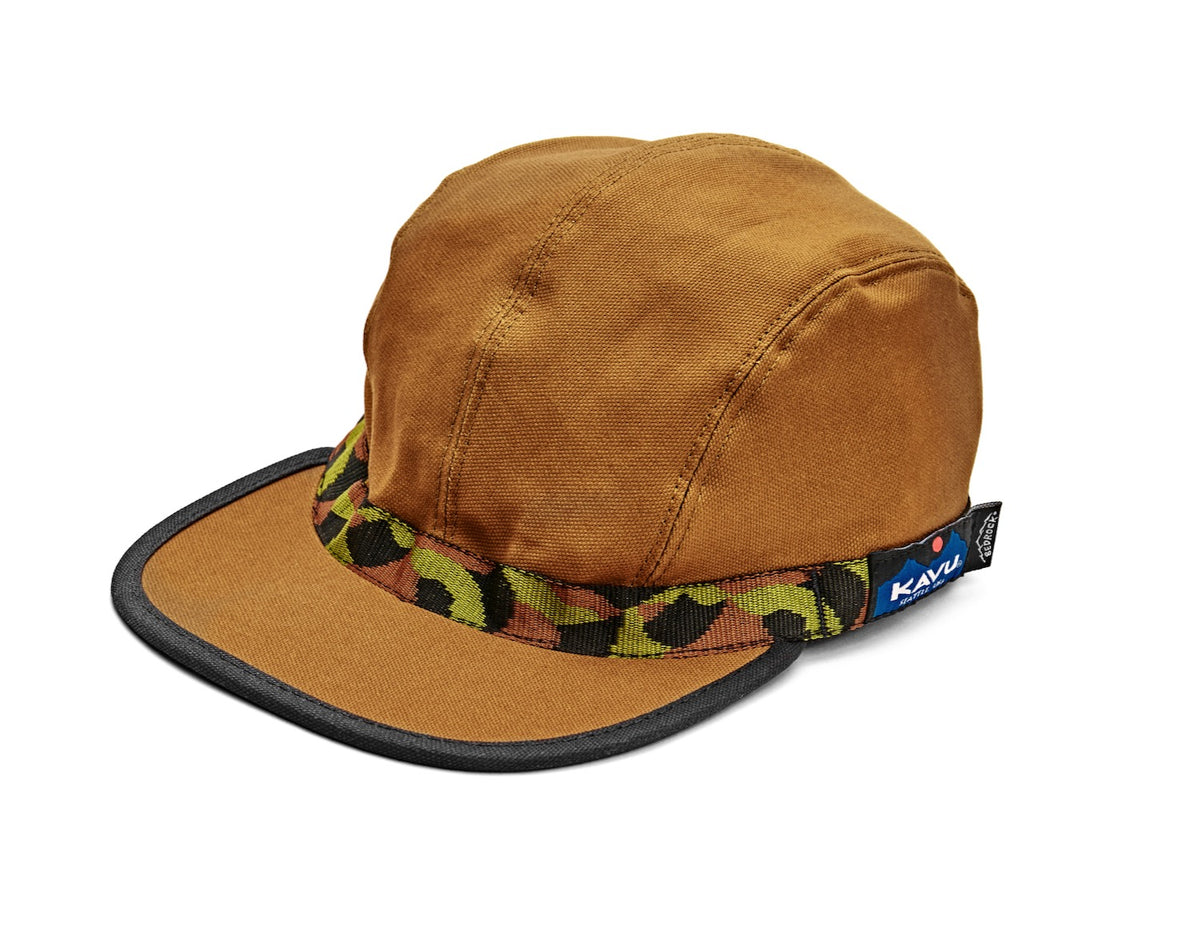 A brown organic cotton strapback hat with 'KAVU' text on the adjustable strap and a 'Bedrock' patterned webbing visor.