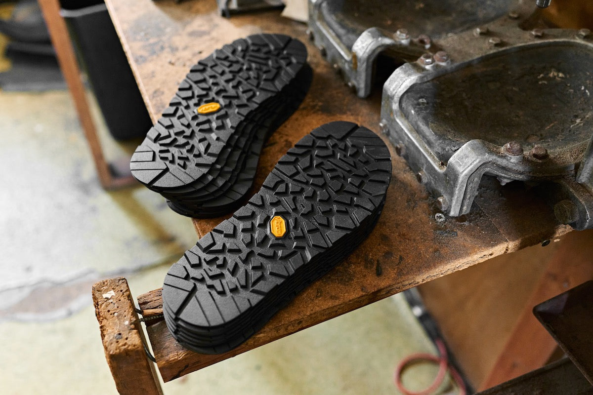 Vibram Mountain Clog soles laying on workbench
