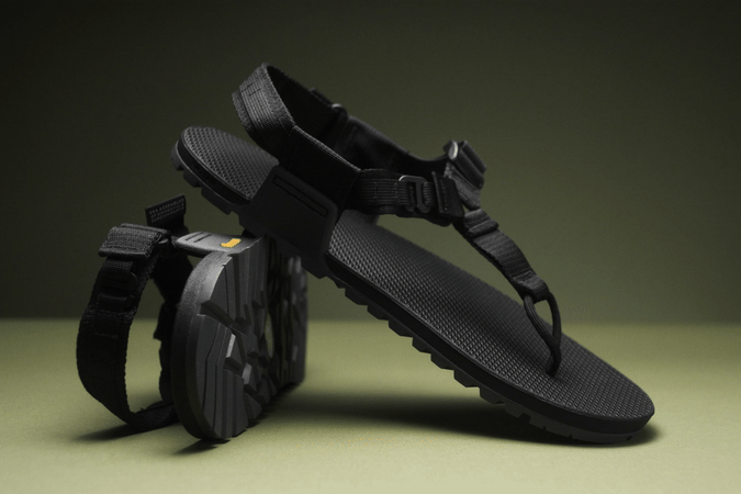 close up shot of a pair of black strapped cairn evo pro sandals