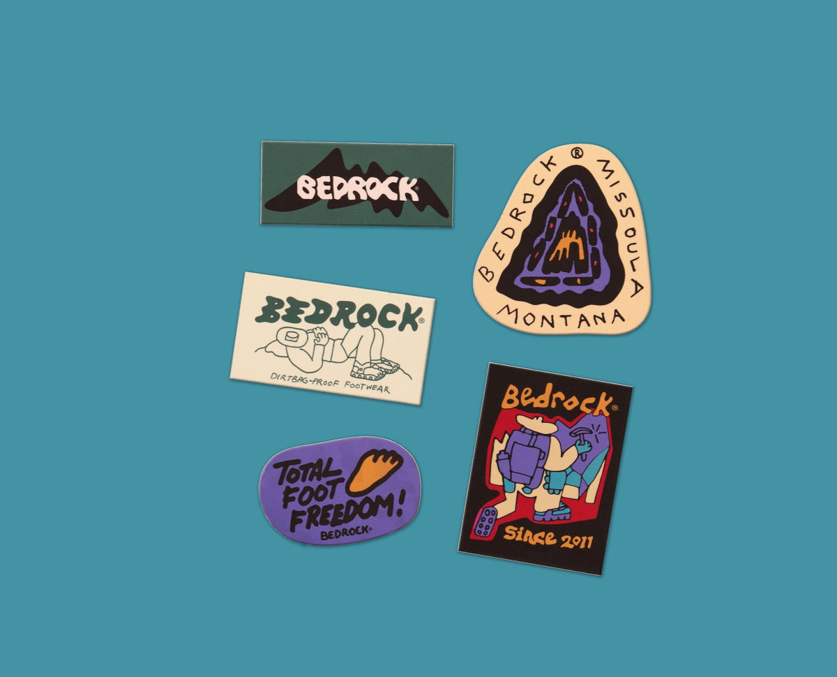 Bedrock die-cut stockers laid out on a blue backdrop