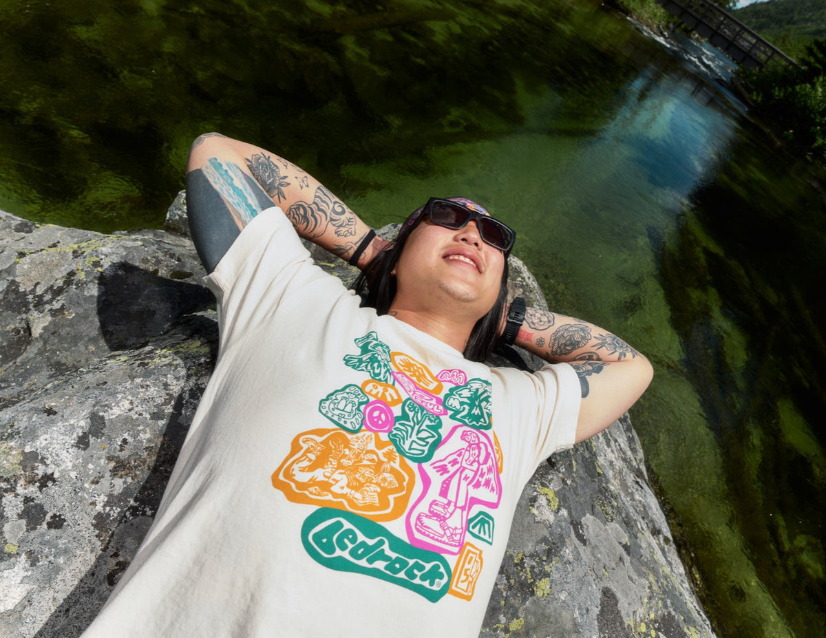Someone wearing a Bedrock archive collage t-shirt