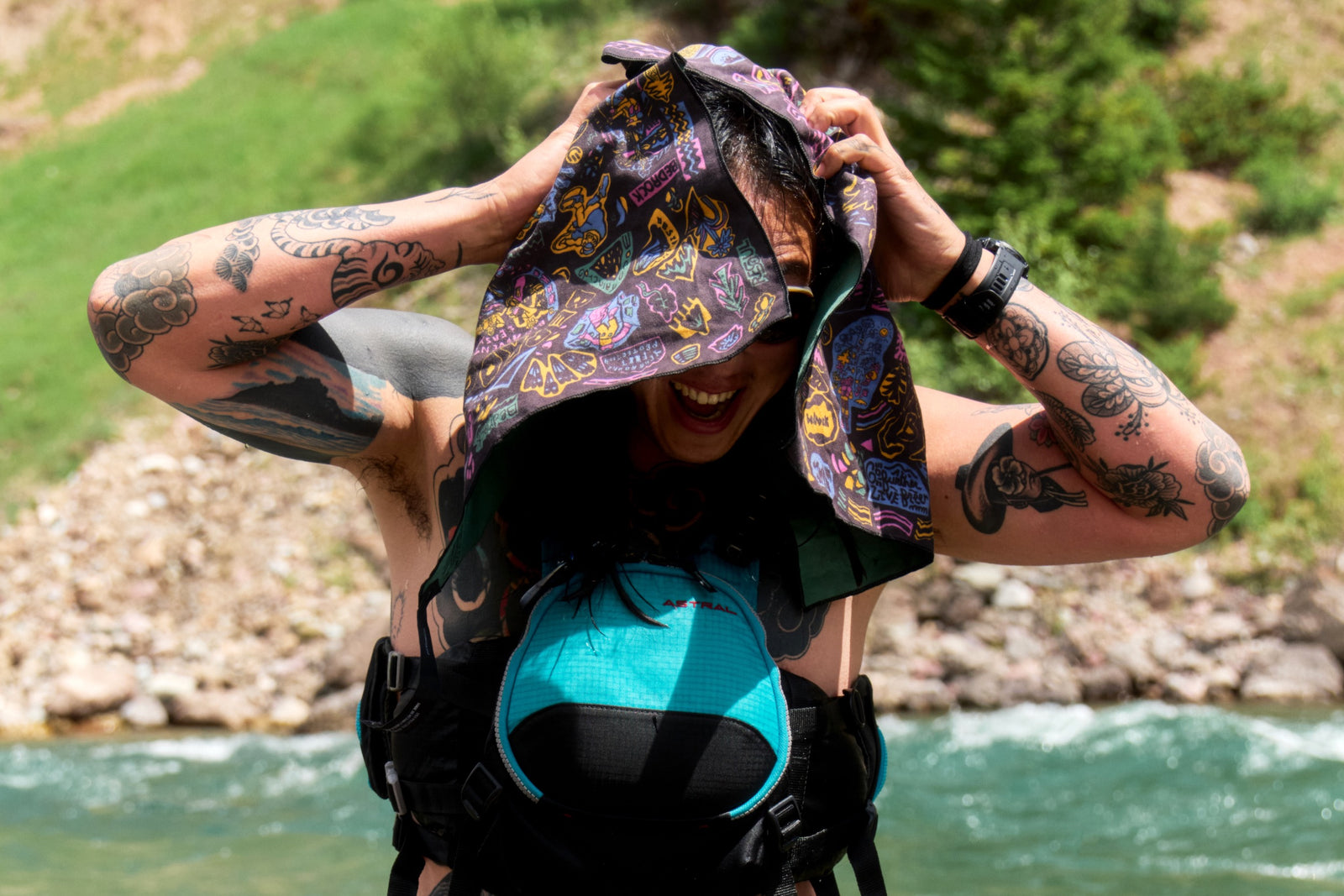 Person drying off with the Bedrock Anniversary towel