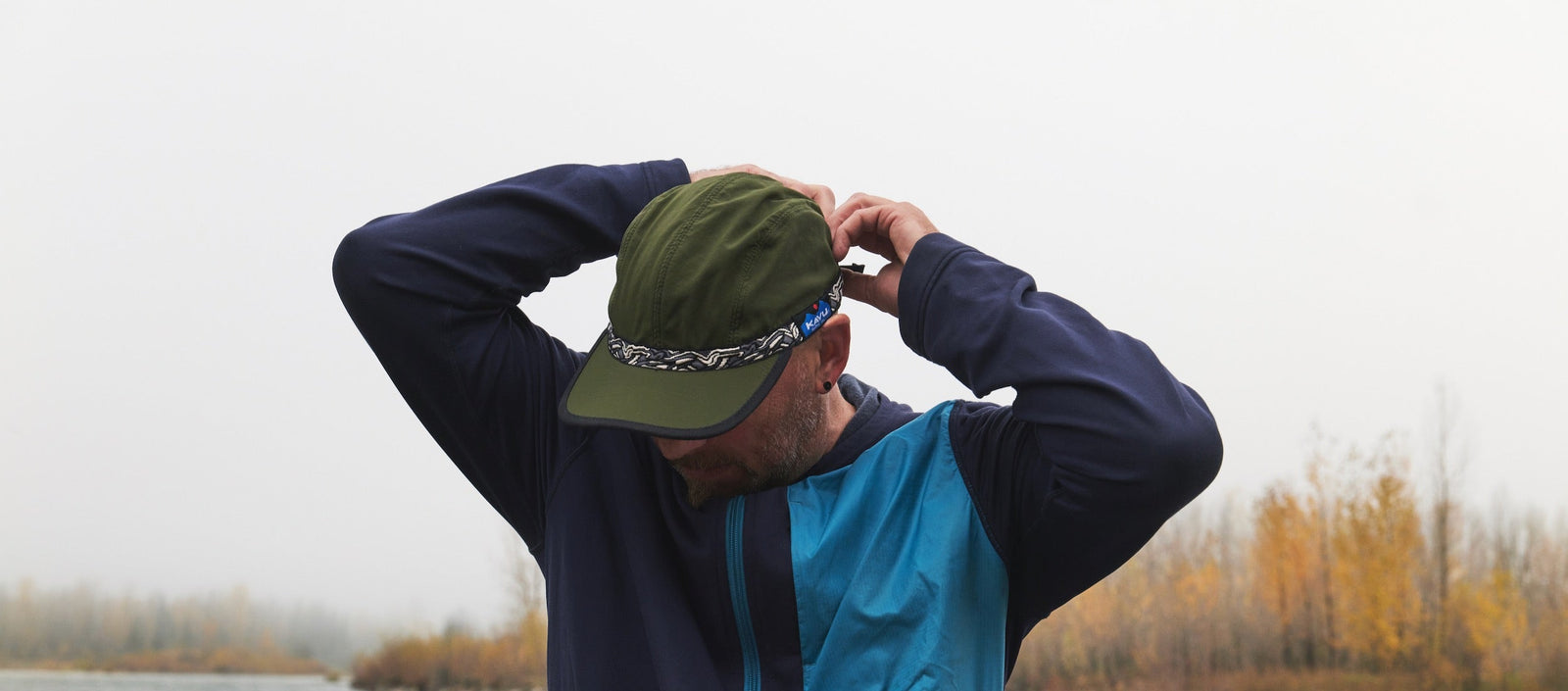 Pearson wearing Army Green Bedrock X Kavu hat