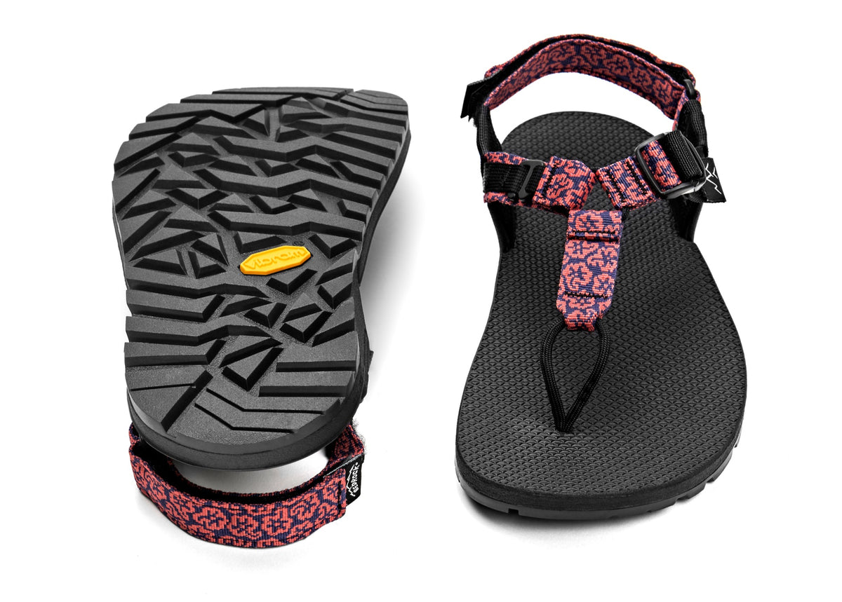 A pair of Cairn Evo Sandals with pink wildflower pattern straps and rugged Vibram XS Trek Evo sole. 