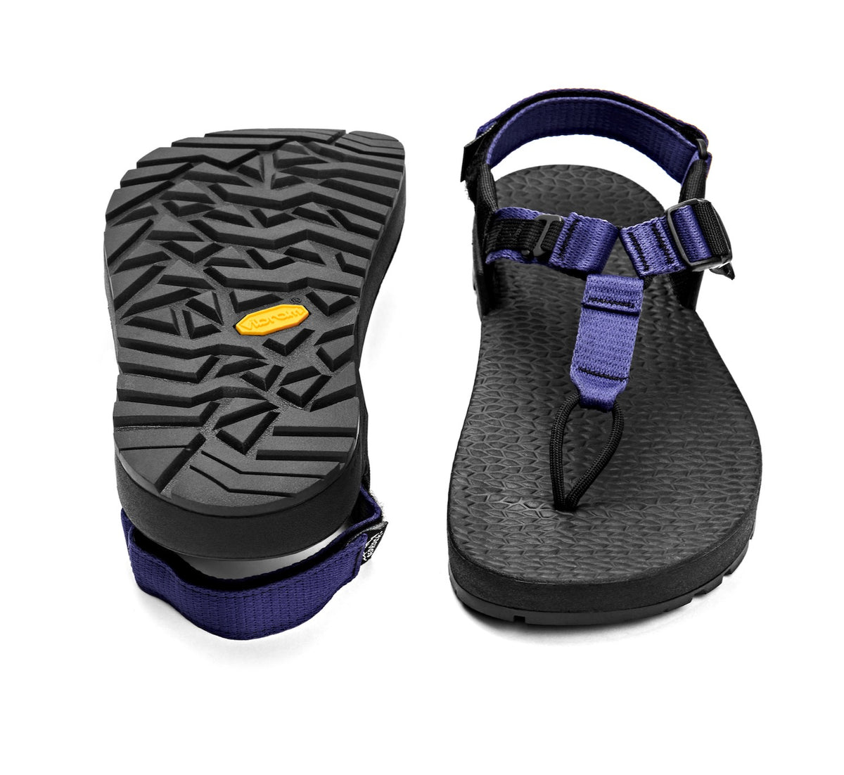A pair of Cairn Evo C Sandals with lupine purple straps and a black rugged sole, including a detailed view of the Vibram XS Trek EVO outsole.