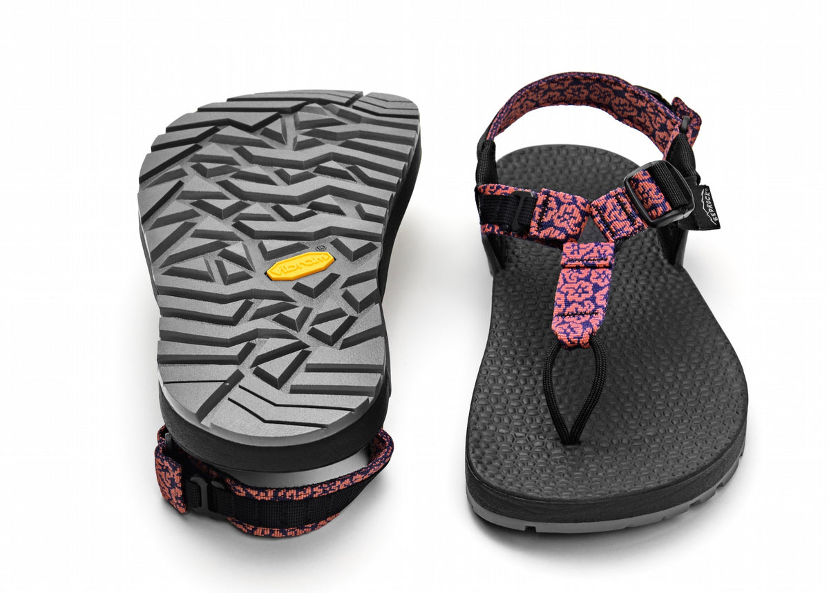 A pair of Cairn Evo 3D PRO sandals with pink wildflower straps, featuring a gray rugged Megagrip vibram sole.