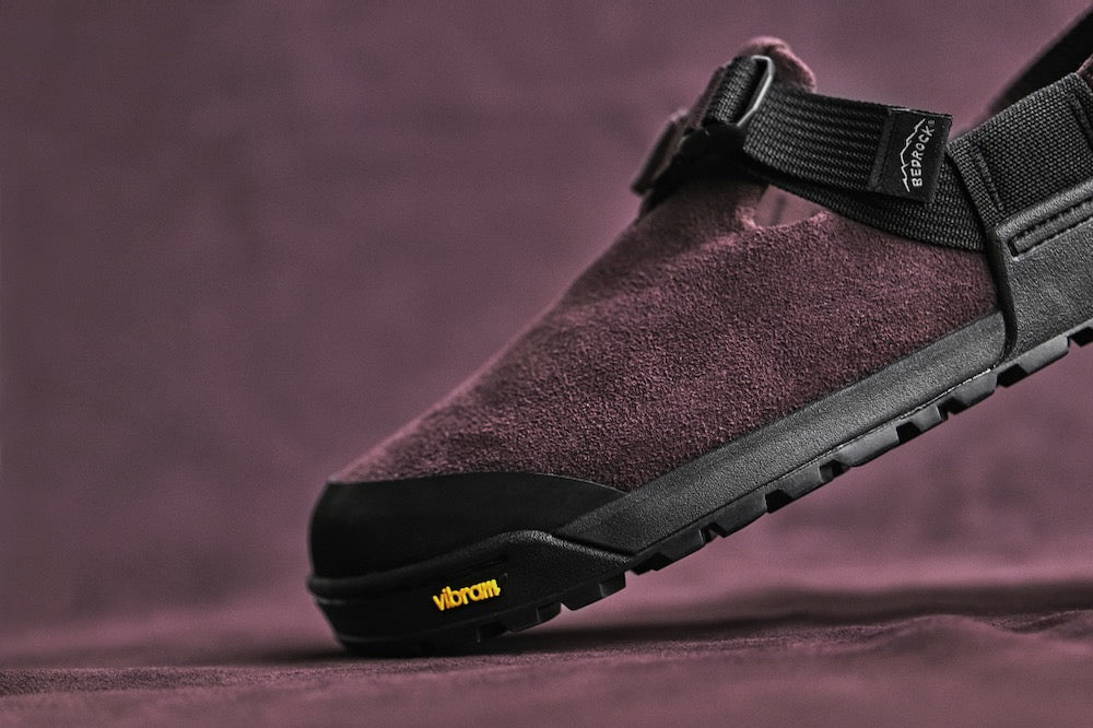 studio photo closeup of deep plum leather suede mountain clog