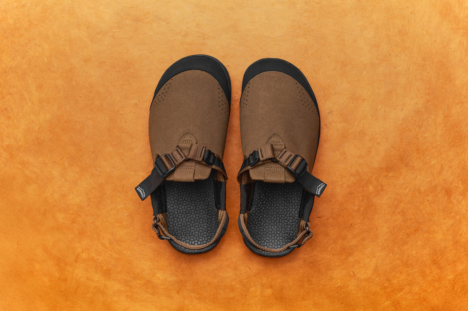 pinecone brown synthetic suede mountain clogs studio photo with brown backdrop