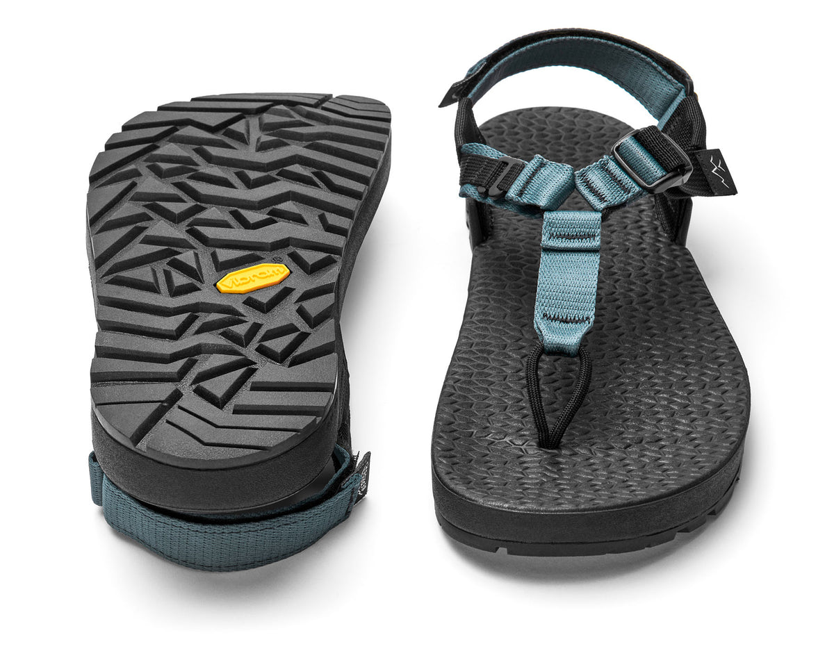 A pair of Cairn Evo C Sandals with blue straps and a black rugged sole, including a detailed view of the Vibram XS Trek EVO outsole.
