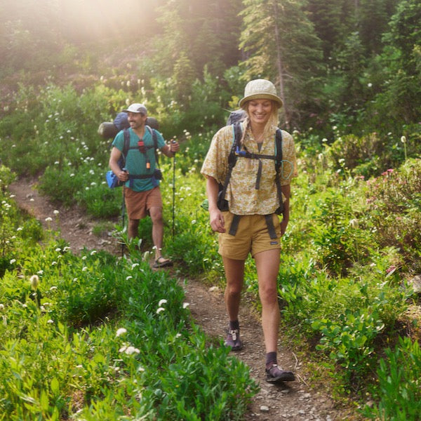 Two people hiking wearing Cairn Evo sandals