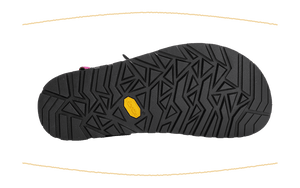 A black athletic shoe sole with a textured geometric tread pattern and a small yellow Vibram logo, shown against a solid green background with decorative gold curved lines.