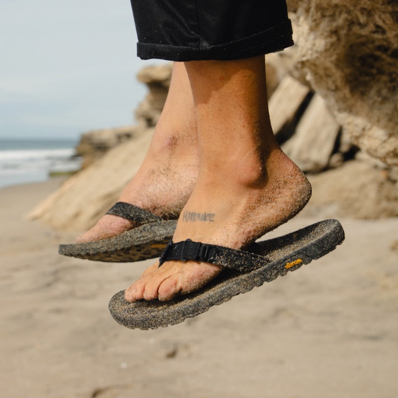 Person wearing bedrock rockhound flip flops