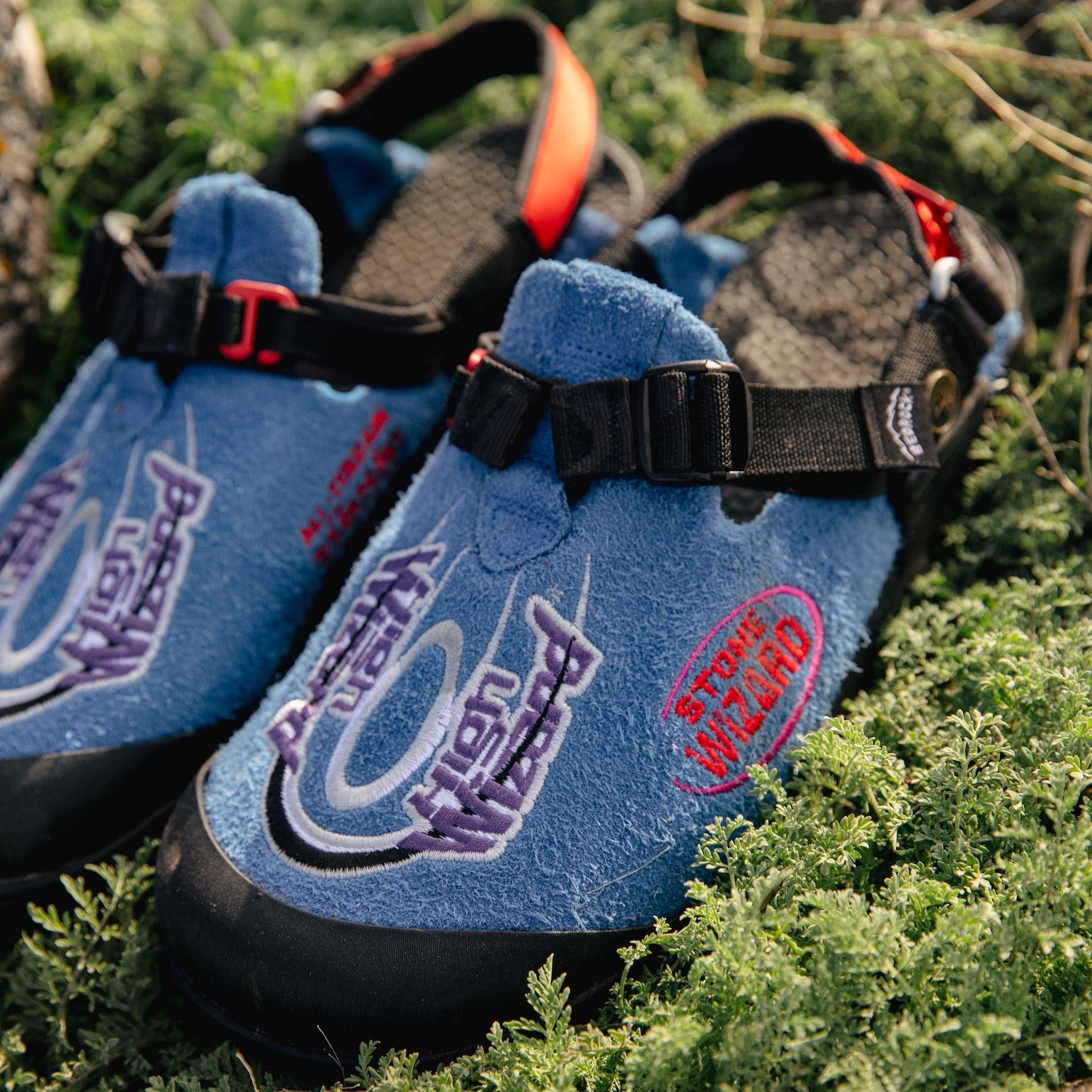 Stone Wizard Cyber Blue Clogs on a grassy background