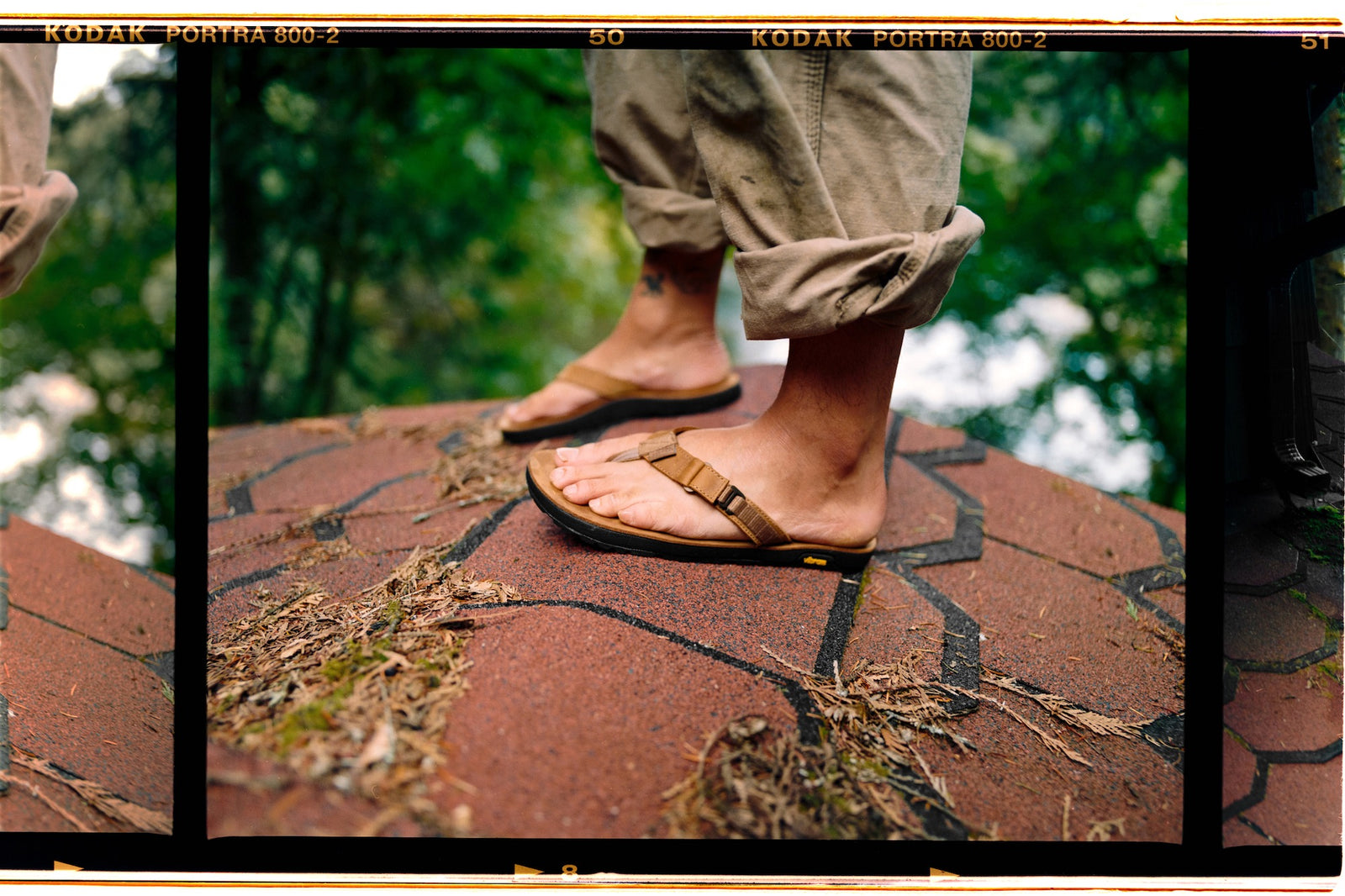 Person wearing sandals on a textured surface roof wearing nubuck leather rockhound sandals