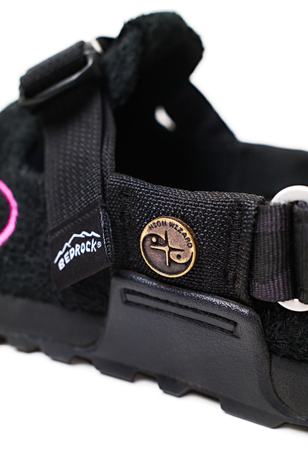 Stone wizard mountain clogs in phantom black with detail of the high wizard button